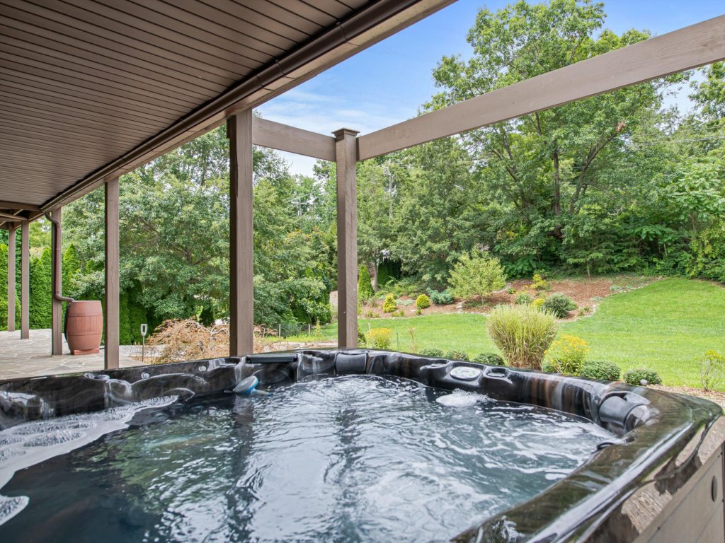 North Asheville Home for Sale Near Beaver Lake hot tub conveys with sale