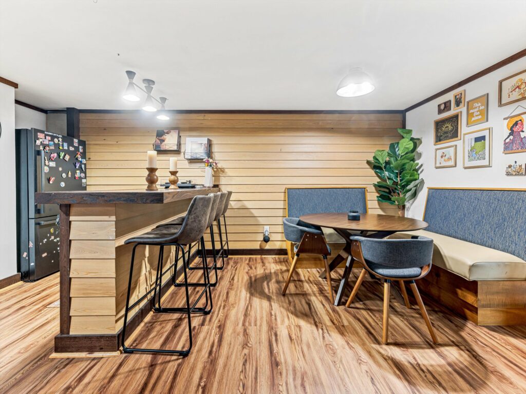 bar and loung area in fully finished basement in Asheville home for sale