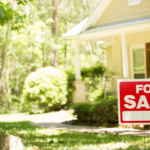 for sale sign in front yard